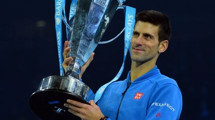 Novak Djokovic a conclu de la plus belle des manières une saison 2015 exceptionnelle en remportant le cinquième Masters de sa carrière. (GLYN KIRK / AFP)