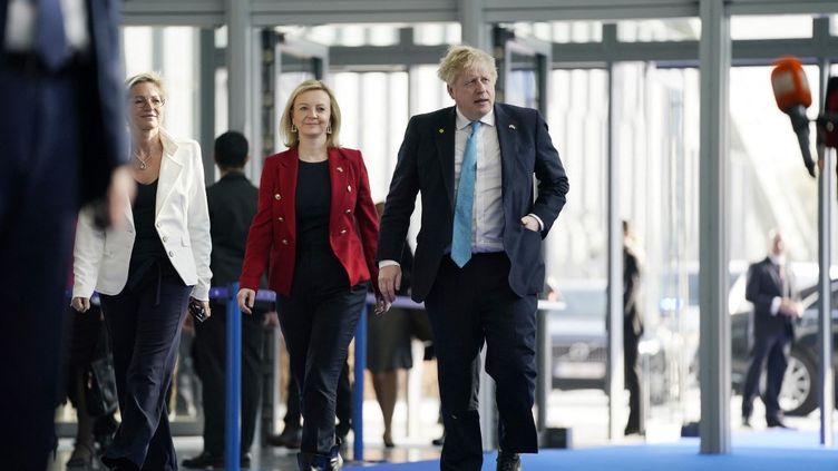 Then British Prime Minister and Foreign Secretary Boris Johnson and Liz Truss, respectively, at NATO headquarters in Brussels on March 24, 2022.  (EVAN VUCCI/POOL/AFP)