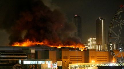 The Crocus City Hall concert hall in flames following a shooting, in Krasnogorsk, near Moscow (Russia), Friday March 22, 2024. (SERGEI VEDYASHKIN / MOSKVA NEWS AGENCY / AFP)