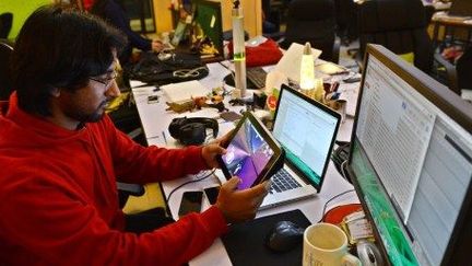 Waqar Azim, concepteur de jeux vidéo dans son bureau d'Islamabad, le 21 janvier 2014. (AFP/Farooq Naeem)