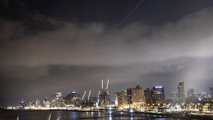 Explosions occur in the sky over Tel Aviv on April 14, 2024, as Iran launched a drone and missile attack against Israel.  (MOSTAFA ALKHAROUF / ANADOLU / AFP)