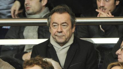 Michel Denisot, dans les tribunes du Parc des Princes le 22 décembre 2013. (JEAN MARIE HERVIO / DPPI MEDIA)