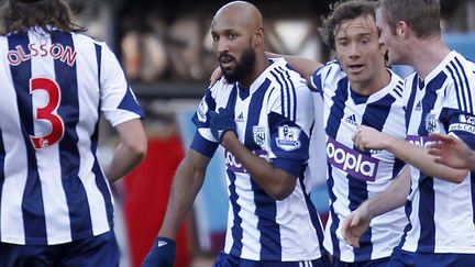 Nicolas Anelka c&eacute;l&egrave;bre un but, le 28 d&eacute;cembre 2013, lors d'un match entre West Ham et West Bromwich Albion. (IAN KINGTON / AFP)