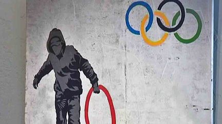 Fragment d'un graf de de Banksy réalisé au moment des JO de Londres
 (France3/culturebox)