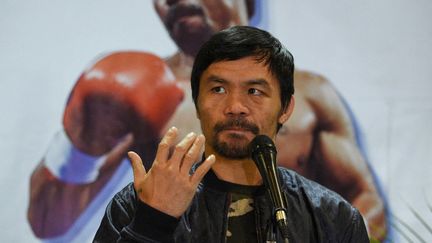 Le boxeur philippin Manny Pacquiao lors d'une conférence de presse à l'aéroport international de Manille, le 24 janvier 2019. (TED ALJIBE / AFP)