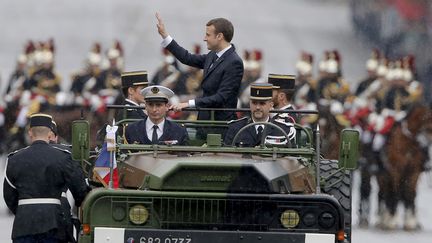 Emmanuel Macron sur les Champs-Elysées à Paris, le 14 mai 2017. (MICHEL EULER / AFP)