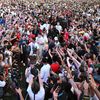 Jean-Charles Valladont, Baptiste Adis et Thomas Chirault célèbrent leurs médailles d'argent remportées en tir à l'arc par équipe masculine avec les supporters français à la grande Halle de La Villette à Paris, le 29 juillet 2024. (MILLEREAU PHILIPPE / KMSP / VIA AFP)