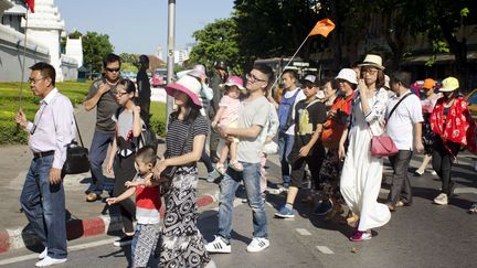 Des touristes chinois dans les rues de Bangkok (Tha&iuml;lande), le 19 ao&ucirc;t 2015. (PENNY YI WANG / AP / SIPA)