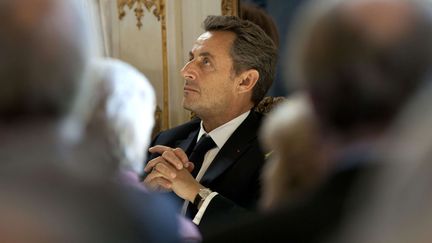 L'ancien pr&eacute;sident de la R&eacute;publique, Nicolas Sarkozy, lors d'une c&eacute;r&eacute;monie &agrave; Bruxelles (Belgique), le 27 mars 2013. (VIRGINIA MAYO / AP / SIPA)