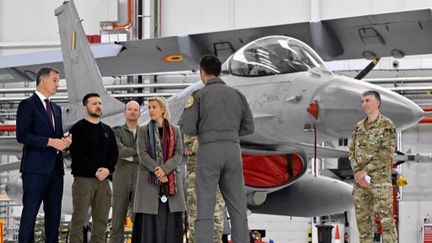 Belgian Prime Minister Alexander De Croo, Ukrainian President Volodymyr Zelensky and Belgian Defence Minister Ludivine Dedonder meet with Belgian F-16 pilots at the military airport in Melsbroek (Belgium), on Tuesday, May 28, 2024. (ERIC LALMAND / BELGA MAG)
