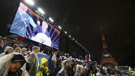 Le président du Comité international olympique (CIO), Thomas Bach, s'exprime lors de la cérémonie d'ouverture des Jeux olympiques de Paris, le 26 juillet 2024.  (BENOIT DOPPAGNE/BELGA MAG/AFP)