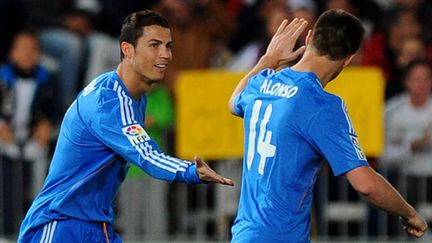 Cristiano Ronaldo et Xabi Alonso (Real Madrid) (JORGE GUERRERO / AFP)