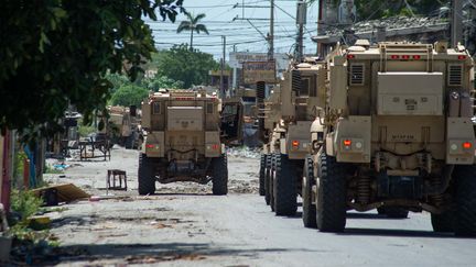 Kenyan army vehicles, part of a Multinational Security Support Mission, patrol Port-au-Prince (Haiti), July 17, 2024. (CLARENS SIFFROY / AFP)