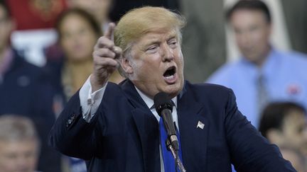 Donald Trump, le candidat à l'investiture républicaine pour la présidentielle américaine, le 12 mars 2016 à Cleveland (Ohio). (BRENDAN SMIALOWSKI / AFP)