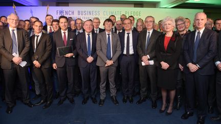 Un peu plus de 90 entreprises se sont engagées à réduire leurs émissions de gaz à effet de serre, lundi 11 décembre, au siège du Medef, en présidence du ministre de la Transition écologique et solidaire Nicolas Hulot.&nbsp; (ERIC PIERMONT / AFP)