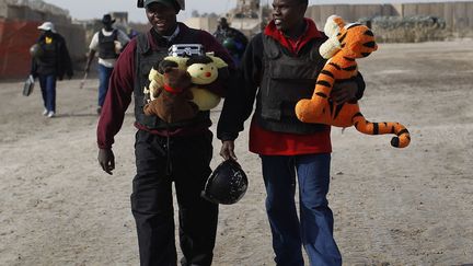 Des ressortissants ougandais dans la base militaire de Kalsu (Irak), le 5 d&eacute;cembre 2011. (SHANNON STAPLETON / REUTERS)