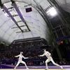 La Polonaise Alicja Klasik face à l'Estonienne Nelli Differt lors du tournoi olympique d'escrime, le 27 juillet 2024, au Grand Palais de Paris. (FRANCK FIFE / AFP)