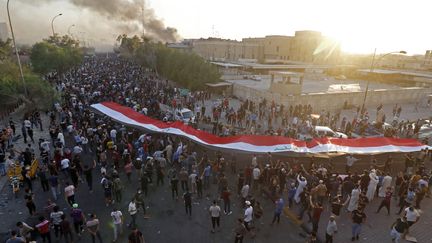 Des manifestants défilent à Bassorah (Irak), le 6 septembre 2018. (HAIDAR MOHAMMED ALI / AFP)