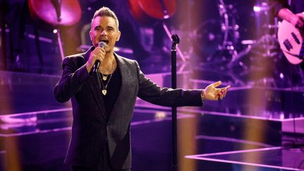 La pop star britannique Robbie Williams lors d'un concert en novembre 2022 (PHILIPP VON DITFURTH / DPA / DPA PICTURE-ALLIANCE VIA AFP)