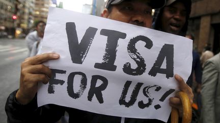 Des manifestants réclament des visas pour les demandeurs d'asile, à Tokyo (Japon), le 9 septembre 2015. (YUYA SHINO / REUTERS)