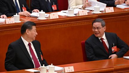 President Xi Jinping and Prime Minister Li Qiang at the opening of the annual session of the Chinese Parliament (GREG BAKER / AFP)