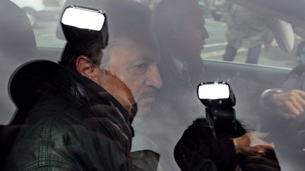 Jean-No&euml;l Gu&eacute;rini &agrave; son arriv&eacute;e &agrave; la gendarmerie &agrave; Marseille (Bouches-du-Rh&ocirc;ne), le 2 avril 2013.&nbsp; (ANNE-CHRISTINE POUJOULAT / AFP)