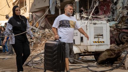 Des habitants de Beyrouth (Liban) doivent quitter leur quartier après des frappes israéliennes, le 11 octobre 2024. (NAEL CHAHINE / MIDDLE EAST IMAGES / AFP)