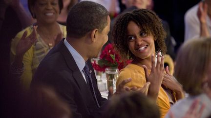 21 juillet 2009. Avec Malia (MATTHEW CAVANAUGH / GETTY IMAGES NORTH AMERICA)