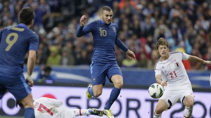 Karim Benzema n'est pas parvenu &agrave; trouver le chemin des filets face aux Japonais, vendredi 12 octobre. (KENZO TRIBOUILLARD / AFP)