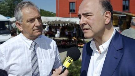 Pierre Moscovici (PS) et Charles Demouge (UMP), candidats dans le Doubs (SEBASTIEN BOZON / AFP)