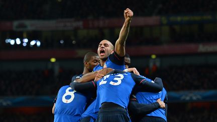 Le d&eacute;fenseur tunisien Aymen Abdennour c&eacute;l&egrave;bre la victoire de son club, l'AS Monaco, face aux Gunners d'Arsenal. (GLYN KIRK / AFP)