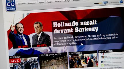 Capture d'&eacute;cran du site 20minutes.ch qui a donn&eacute; le nom des deux candidats pour le second tour de la pr&eacute;sidentielle avant 20 heures, le dimanche 22 avril 2012. (FABRICE COFFRINI / AFP)