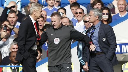 Arsène Wenger (Arsenal) et Jose Mourinho, ici en 2014 où il dirigeait Chelsea, ne se sont jamais bien appréciés... (ADRIAN DENNIS / AFP)