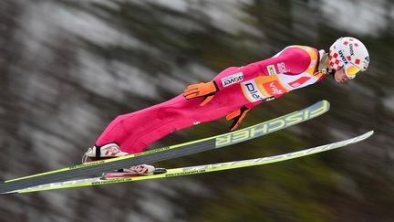 Kamil Stoch a une réputation à défendre (JURE MAKOVEC / AFP)