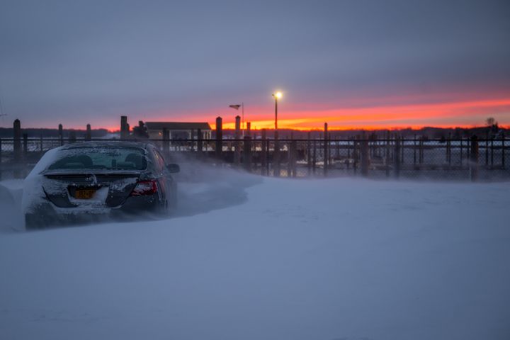 The sun sets over Stony Brook, New York, on January 29, 2022.   (ANDREW THEODORAKIS / GETTY IMAGES NORTH AMERICA / AFP)