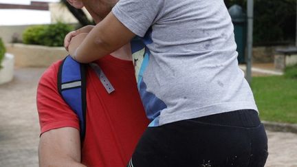 Kenzo et son père Laurent, à Grosseto-Prugna (Corse-du-Sud), le 4 juin 2023. (PASCAL POCHARD-CASABIANCA / AFP)