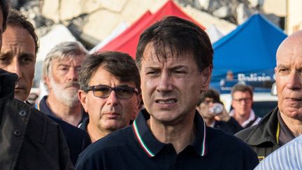 Le président du Conseil Giuseppe Conte arrive sur les lieux de l'effondrement du pont Morandi à Gênes, le 14 août 2018. (FEDERICO SCOPPA / AFP)