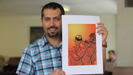 Le dessinateur iranien Hadi Heidari, le 7 juin 2013, à Téhéran (Iran). (ATTA KENARE / AFP)