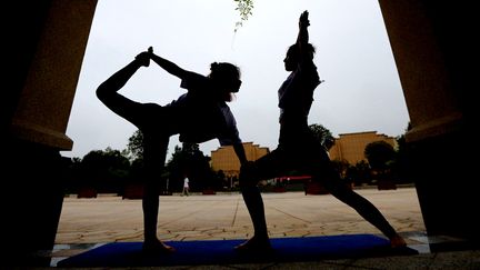 Séance de yoga à Xiajiang, en Chine, pour la Journée internationale du yoga le 21 juin 2018.&nbsp; (CHEN FUPING / XINHUA / AFP)