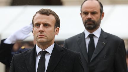 Emmanuel Macron et Edouard Philippe, à l'hôtel des Invalides, à Paris, le 28 mars 2018.&nbsp; (LUDOVIC MARIN / AFP)