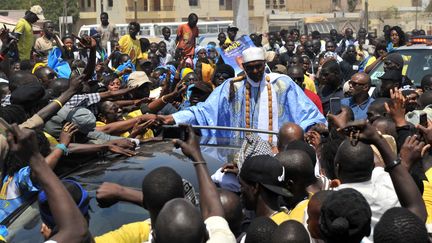 Le pr&eacute;sident Abdoulaye Wade, en campagne &agrave; Dakar, le vendredi 23 mars. (ISSOUF SANOGO / AFP)