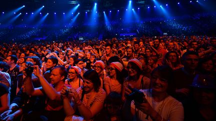 Les fonds issus des concerts et des albums des Enfoirés seront reversés aux&nbsp;Restos&nbsp;du Cœur. Ci-contre le concert des Enfoirés, en 2014 à Strasbourg. (PATRICK HERTZOG / AFP)