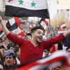 La joie des supporters de l'équipe nationale de Syrie dans les rues de Damas après le barrage aller des qualifications au Mondial, contre l'Australie, le 5 octobre 2017. (LOUAI BESHARA / AFP)