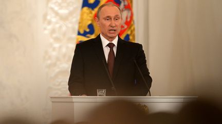 Vladimir Poutine, le pr&eacute;sident russe, lors d'une session du Parlement russe sur la question de la Crim&eacute;e, &agrave; Moscou, le 18 mars 2014. (KIRILL KUDRYAVTSEV / AFP)