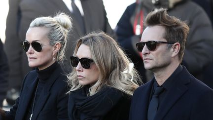 Laeticia Hallyday, Laura Smet et David Hallyday lors de l'hommage à Johnny Hallyday à La Madeleine à Paris, le 6 décembre 2017. (MAXPPP)