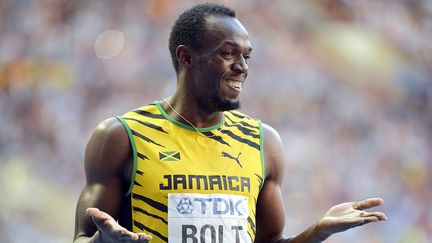 Le Jama&iuml;cain Usain Bolt, apr&egrave;s sa victoire en demi-finale du 200 m, le 16 ao&ucirc;t 2013, aux Mondiaux d'athl&eacute;tisme de Moscou. (ERIC LALMAND / BELGA MAG)