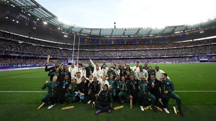 The gold medal-winning French team poses with silver medalists Fiji and bronze medalists South Africa. (LUI SIU WAI / XINHUA)