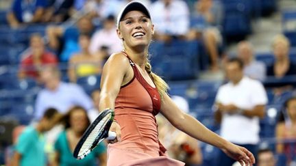 Caroline Wozniacki tout sourire après sa qualification en demi-finale de l'US Open 2014 (STREETER LECKA / GETTY IMAGES NORTH AMERICA)