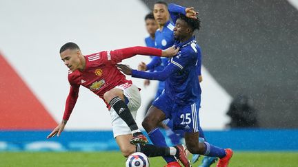 Mason Greenwood (Manchester United) et&nbsp;Wilfred Ndidi (Leicester), à l'occasion de la rencontre Manchester United-Leicester, le 11 mai 2021. (DAVE THOMPSON / POOL)