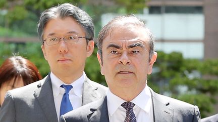 Carlos Ghosn (à droite) à Tokyo, la capitale japonaise, le 23 mai 2019. (ICHIRO OHARA / YOMIURI / AFP)